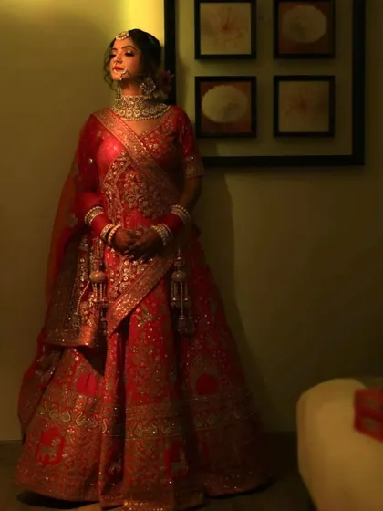A full-length portrait of this beautiful bride. The dramatic lighting adds a touch of royalty to her look.