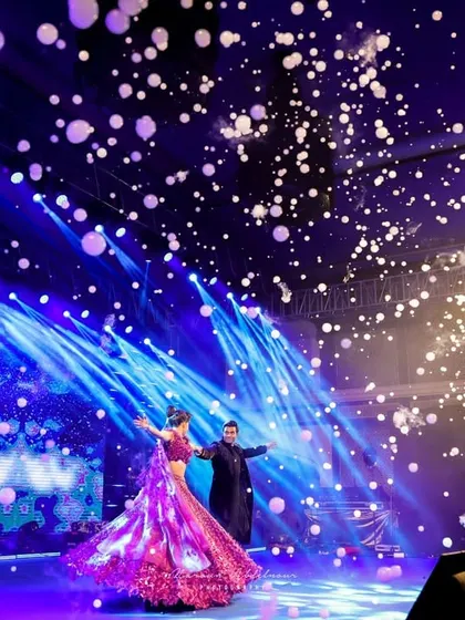 A couple's dance under a shower of bubble confetti. We use creative effects like this to add a touch of whimsy and magic to key moments like the first dance.