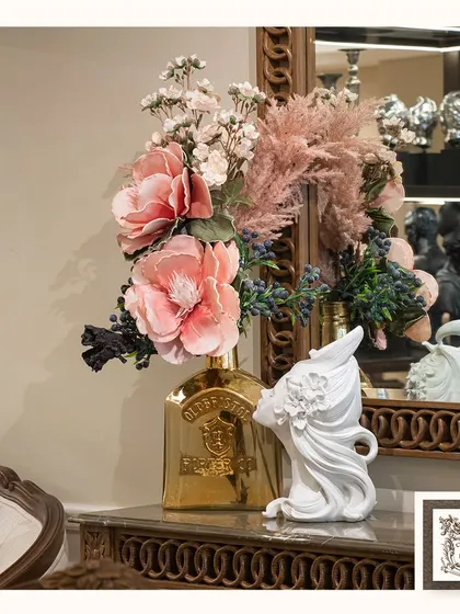 A festive and flourishing arrangement perfect for celebrating any occasion. The mix of pink peonies, pampas grass, and other blooms creates a full and luxurious display.