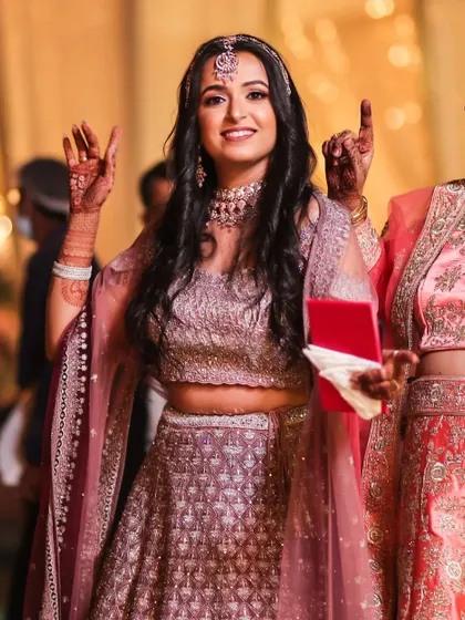 You glow differently when you're happy. This candid shot captures my client Sakshi enjoying her sister's wedding, looking radiant in her party makeup.