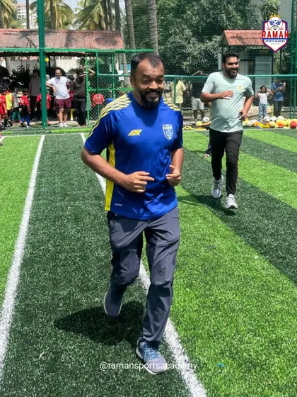 An adult participant jogging on the field during our Community Fest. These events are a great way for everyone to get active and enjoy the game in a relaxed, fun setting.