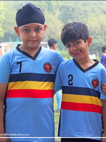 A fun pose from two of our U-8 players. It's important to balance hard work with fun to keep the kids motivated and happy.