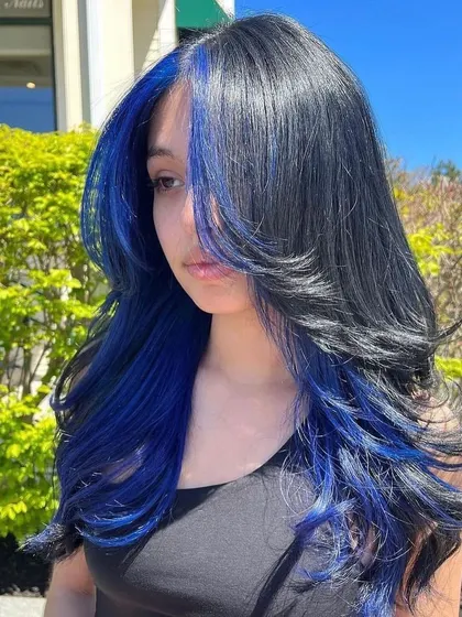 A bold, face-framing blue color. This high-contrast look makes features pop and adds incredible vibrancy to a simple haircut.