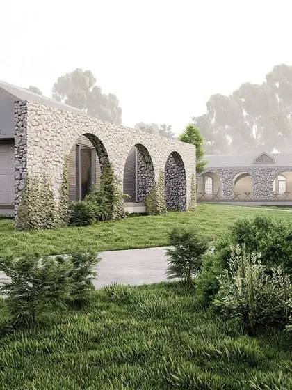 The design render for a 10,000 sq.ft. luxury farmhouse. After months of planning, we are excited to bring this vision of stone arches and natural integration to life.