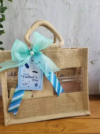 This charming jute bag with a window is a great eco-friendly option for a Father's Day gift, offering a peek at the delicious treats packed inside.