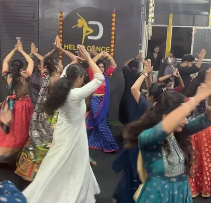 The whole studio dancing in unison during our Dandiya event. We choreograph group routines that look spectacular and are fun to learn.