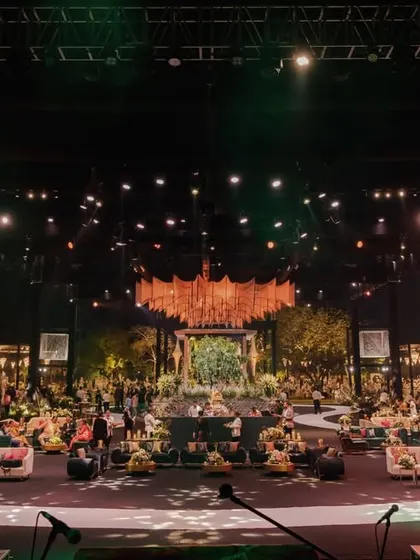 The full scale of the musical-themed reception, with its grand structures, suspended decor elements, and multiple lounge areas, all designed to tell a cohesive story.