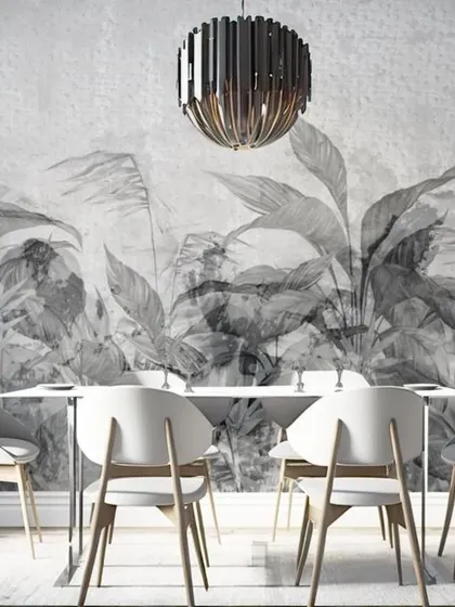A beautiful grayscale mural of tropical leaves, perfect for a modern dining area. The lack of color emphasizes the shapes and textures of the foliage, creating a sophisticated and artistic look.