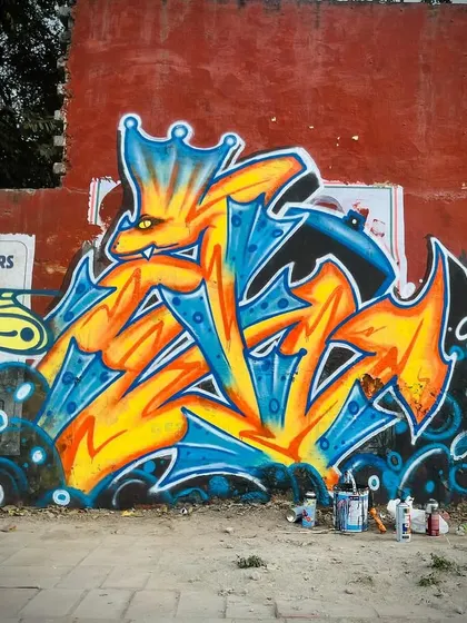 I call this one the Graffiti Dragon. Its body is formed from Devanagari script, and it holds a spray can, ready to paint. It represents the fusion of my Indian heritage and my artistic soul.