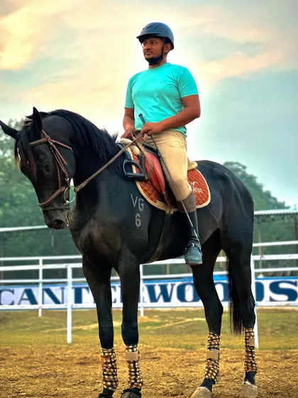 A rider sits tall and confident on his horse, demonstrating the proper posture taught by our instructors. The "Chin Up Heels Down" mantra is key to good riding.