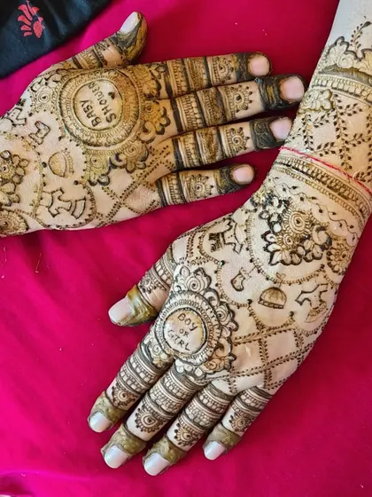 Another angle of the 'Boy or Girl?' baby shower mehendi. The design is filled with festive elements like balloons and rattles, making it very thematic.