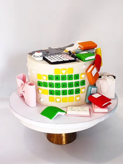 A side view of the intensive custom cake, showing the ballet shoes and shopping bags. I love creating cakes that tell a personal story.
