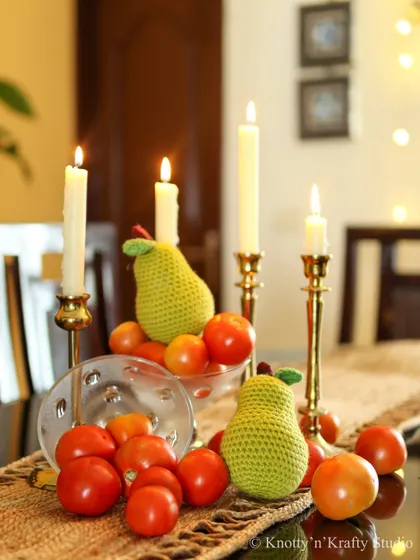A different angle of the pear and tomato tablescape, showing how simple, everyday items can be transformed into something beautiful.