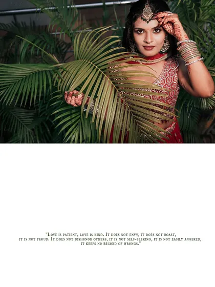 A wide shot of the bride posing with a palm leaf, creating a stylish and modern bridal portrait.