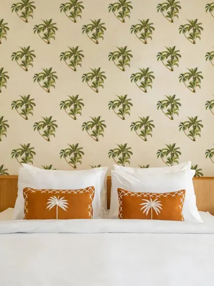 Our Beach Green Palm Tree wall sticker pattern creates a peaceful and relaxing feature wall in this bedroom. The design is perfect for creating a tranquil and inviting retreat.