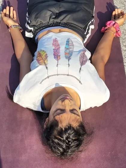Surrendering into Savasana. This pose is a practice of letting go, of returning to the universal flow from which everything comes and to which everything returns.