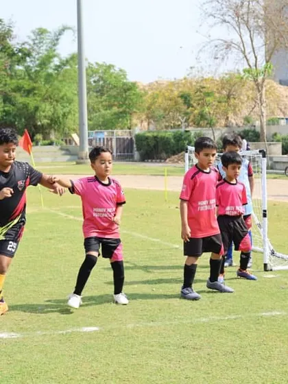 Players battle for the ball near the goal line in a hard-fought league match.
