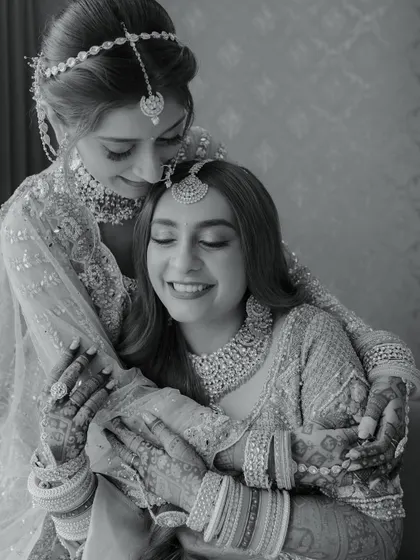 A tender moment between sisters on the wedding day. This black and white photo is filled with love and emotion.