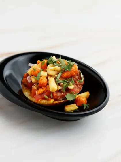 A creative South-meets-West fusion. We top crispy paniyaram (a South Indian classic) with fiery Maharashtrian misal, creating a unique appetiser that is an explosion of flavour in a single bite.