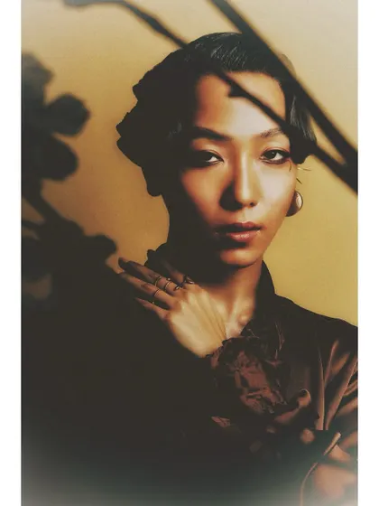 This portrait uses shadows from a plant to create interesting patterns on the model. Using simple props and light can add depth and a narrative element to a straightforward portrait.