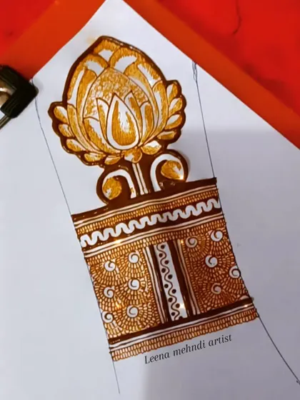 A close-up of a large lotus cuff being practiced on paper. Mastering these large, central elements is a key focus in my floral henna art classes.