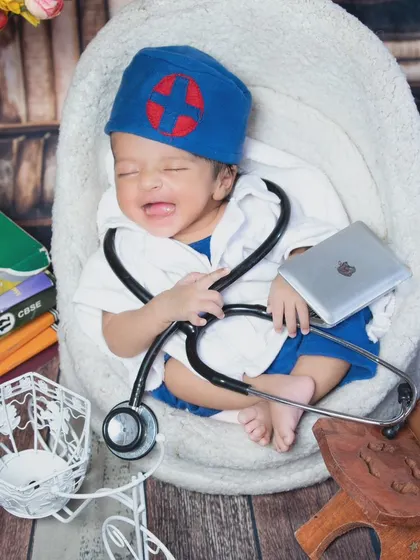 Even doctors have their tough days. This crying newborn in a doctor's outfit is a funny and relatable moment for any parent.