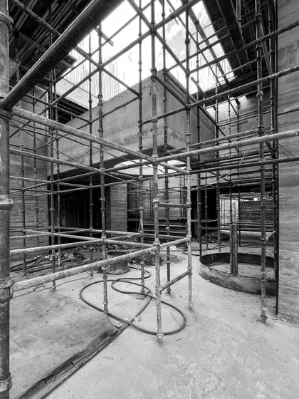 The interior of the Moradabad villa, filled with a dense web of scaffolding. This temporary structure is necessary to support the formwork for the complex concrete shapes.