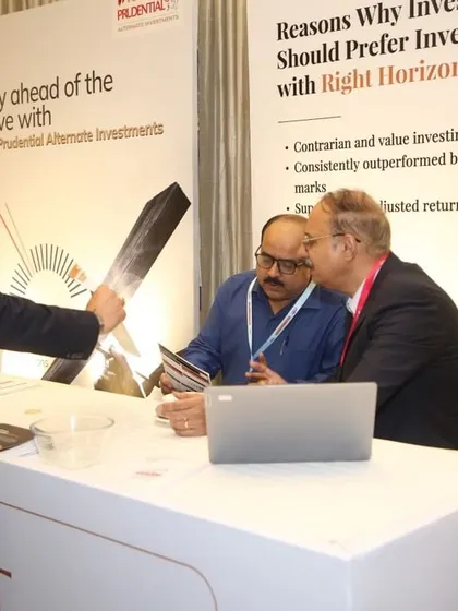 Another view of our team engaging with attendees at our event booth. We believe in direct interaction to better understand investor needs and explain our value proposition, such as our contrarian and value investing approach.