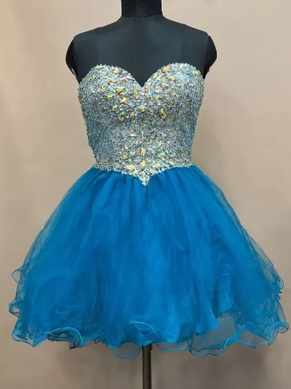 This short and flirty blue frock is perfect for a birthday party or a fun pre-wedding shoot. The bodice is covered in sparkling crystals, adding a touch of glamour.
