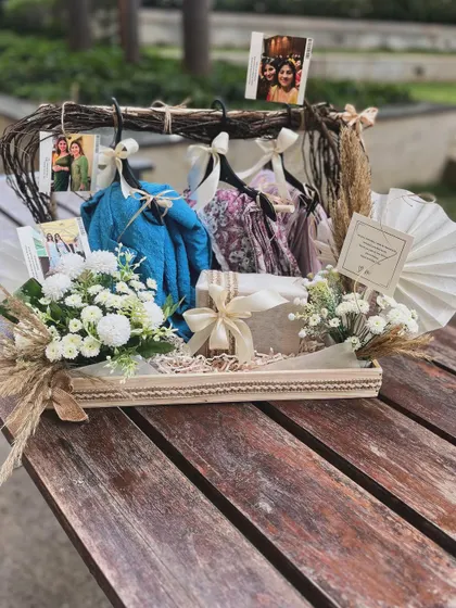Styling hanger hampers is a unique way to present apparel gifts. For this best friend's birthday, I created a natural, timeless look with off-white pastels and dried grasses.