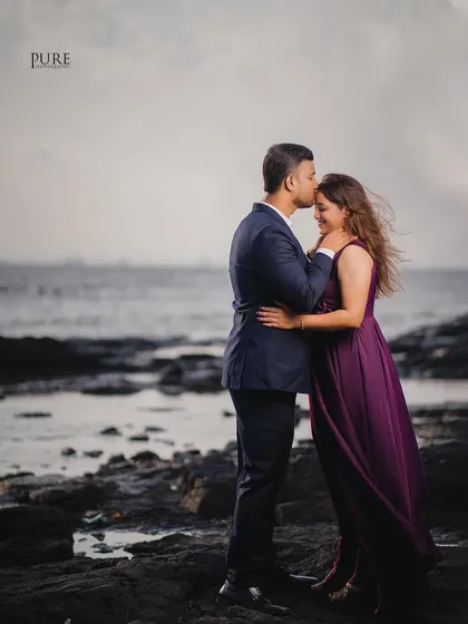 A sweet forehead kiss on a windy beach. The movement in Kiran's hair and the soft light give this photo a candid and natural feel.