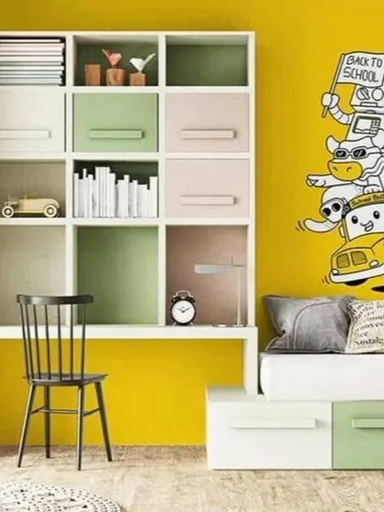 A duplicate of media 187, this image highlights how a small touch of graphic wallpaper can add personality to a child's desk and bedroom.