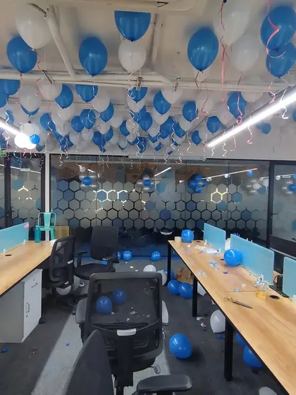 Inside the Ripplr office, I filled the workspace with blue and white balloons. This image shows how even a simple addition of balloons can make the entire office feel part of the anniversary celebration.