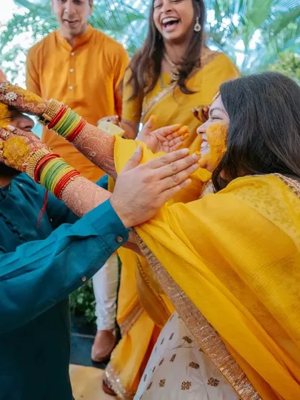 The Haldi ceremony is full of candid, joyful moments. Here, guests playfully apply turmeric to the bride and groom, and we are there to ensure the setting is as beautiful as the emotions.