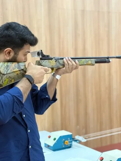 Mr. Omar Haris Nalapad takes aim with an air rifle. We welcome leaders and influencers to experience the sport and discover the mental benefits of precision shooting.