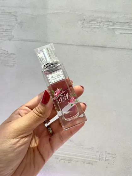 Combining painting and engraving for a client at a Dior event. This Miss Dior bottle features a hand-painted monogram, making it a truly one-of-a-kind piece.
