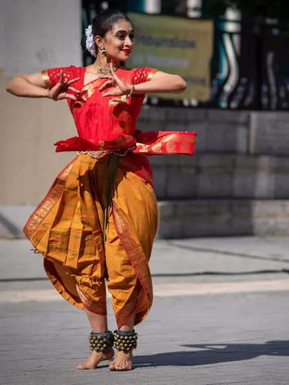 A moment of "Ananda" or bliss, captured during an outdoor performance of Marathi Abhangas in London.