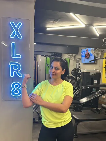 A happy and strong member showing off her progress. This is the confidence that comes from feeling fit and powerful.