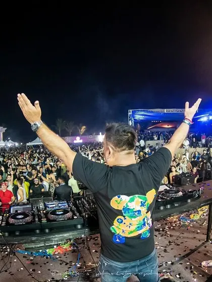 Arms up to the sky, embracing the energy of thousands at the Mandala Festival. These are the moments that define my career as a DJ.