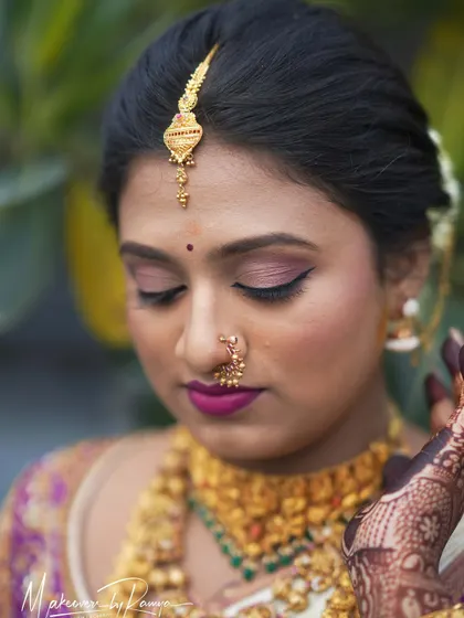 A detailed close-up of Pooja's Muhurtham makeup. You can see the soft blend of the eyeshadow and the precise application that ensures the makeup enhances, rather than masks, her features.