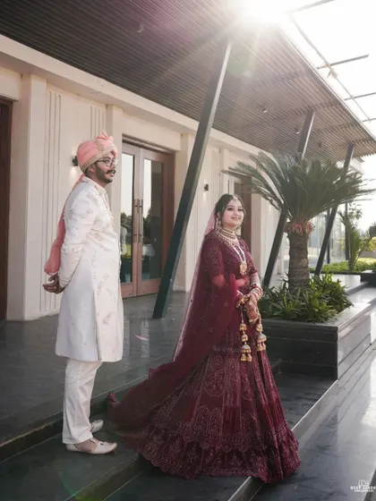 A stylish portrait of the bride and groom. The low angle and the architectural lines of the venue add a contemporary feel to this wedding shot.
