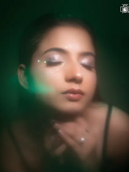 Another creative lighting setup with a green flare. This artistic approach to a beauty shot shows how we can experiment to produce unique and memorable images for a makeup portfolio.