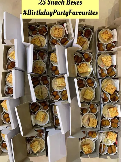 A large order of snack boxes with a modern menu, perfect for a kids' party.