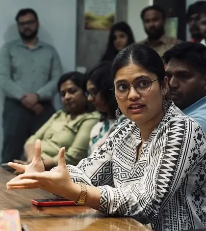 A team member presenting her ideas during a review, from the Forbes India feature.