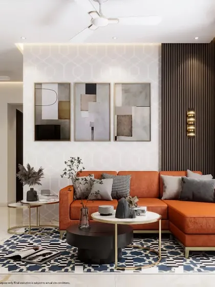 This living room makes a statement with a bold orange sectional sofa and a patterned blue rug. The dark wood paneling adds a touch of warmth and texture.