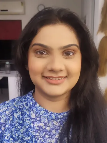 A close-up of a straight makeup look. The skin looks smooth and even, the brows are defined, and a touch of mascara opens up the eyes.