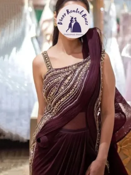 A client modeling our modern draped saree gown. This is a stylish and unique outfit for a wedding reception or special event.