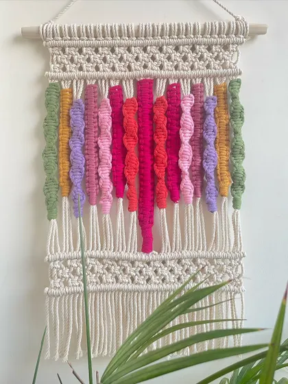 This is another version of my colorful abstract wall hanging, featuring a palette of pinks, purples, and greens. Each piece is unique, depending on how the colors inspire me that day.