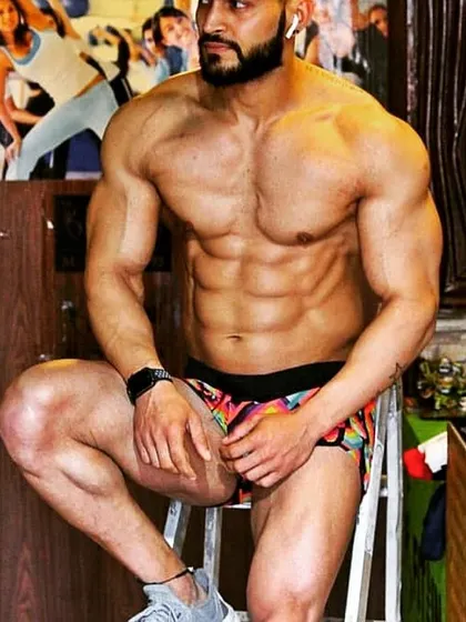 A different angle from the same series, showing the physique from a seated pose. Strength and aesthetics can be displayed in many ways.