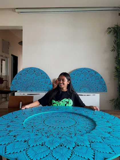 The complete set of three blue mandalas, including a full circle and two half circles, ready to be delivered to a restaurant in Pune.